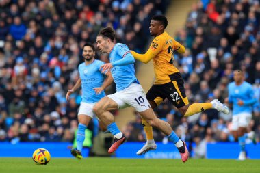Jack Grealish #10 of Manchester City runs past Nelson Semedo #22 of Wolverhampton Wanderers during the Premier League match Manchester City vs Wolverhampton Wanderers at Etihad Stadium, Manchester, United Kingdom, 22nd January 202
