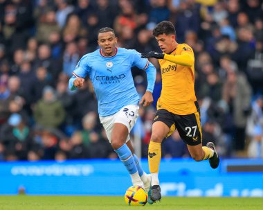 Matheus Nunes #27 of Wolverhampton Wanderers gets away from Manuel Akanji #25 of Manchester City during the Premier League match Manchester City vs Wolverhampton Wanderers at Etihad Stadium, Manchester, United Kingdom, 22nd January 202