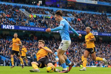 Max Kilman #23 of Wolverhampton Wanderers tackles Jack Grealish #10 of Manchester City during the Premier League match Manchester City vs Wolverhampton Wanderers at Etihad Stadium, Manchester, United Kingdom, 22nd January 202