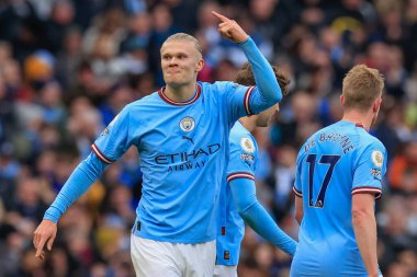 Erling Hland #9 of Manchester City celebrates his goal to make it 1-0 during the Premier League match Manchester City vs Wolverhampton Wanderers at Etihad Stadium, Manchester, United Kingdom, 22nd January 2023 clipart