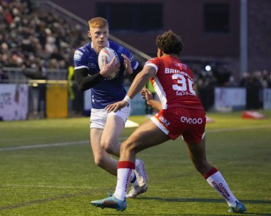 Harvey Barron #26 of Hull FC runs at Mekhi Bridgeman-Reaney #30 of Sheffield Eagles during the Rugby League Pre Season match Sheffield Eagles vs Hull FC at Sheffield Olympic Legacy Park, Sheffield, United Kingdom, 22nd January 202