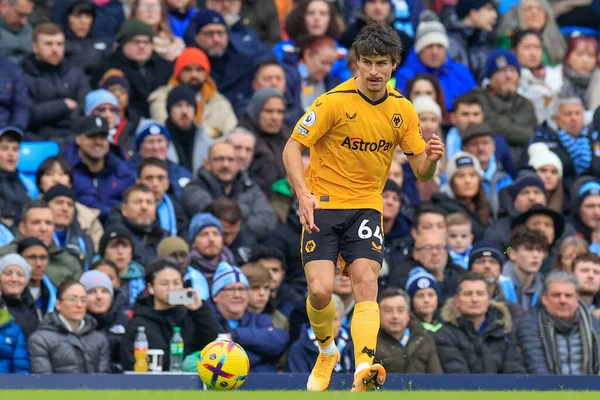 Hugo Bueno #64 of Wolverhampton Wanderers passes the ball during the Premier League match Manchester City vs Wolverhampton Wanderers at Etihad Stadium, Manchester, United Kingdom, 22nd January 202