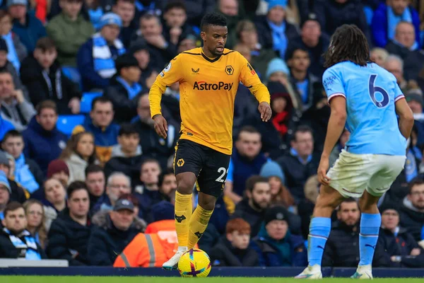 Nlson Semedo #22 of Wolverhampton Wanderers runs at Nathan Ak #6 of Manchester City during the Premier League match Manchester City vs Wolverhampton Wanderers at Etihad Stadium, Manchester, United Kingdom, 22nd January 2023