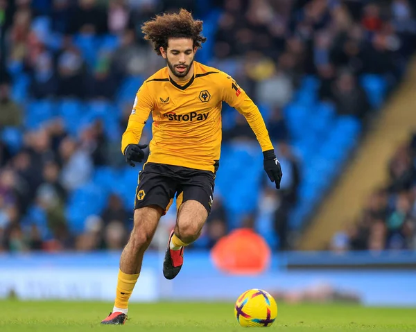 Rayan At-Nouri #3 of Wolverhampton Wanderers runs with the ball during the Premier League match Manchester City vs Wolverhampton Wanderers at Etihad Stadium, Manchester, United Kingdom, 22nd January 2023