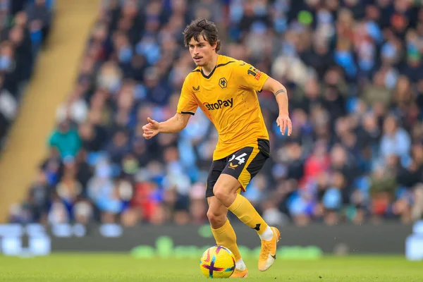 Hugo Bueno #64 of Wolverhampton Wanderers runs with the ball during the Premier League match Manchester City vs Wolverhampton Wanderers at Etihad Stadium, Manchester, United Kingdom, 22nd January 202