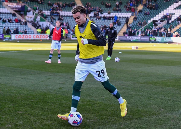 Plymouth Argyle midfielder Tyreik Wright (29) warming up  during the Sky Bet League 1 match Plymouth Argyle vs Cheltenham Town at Home Park, Plymouth, United Kingdom, 21st January 202