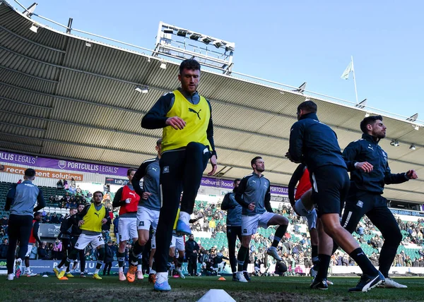 Plymouth Argyle defender Dan Scarr  (6) warming up  during the Sky Bet League 1 match Plymouth Argyle vs Cheltenham Town at Home Park, Plymouth, United Kingdom, 21st January 202