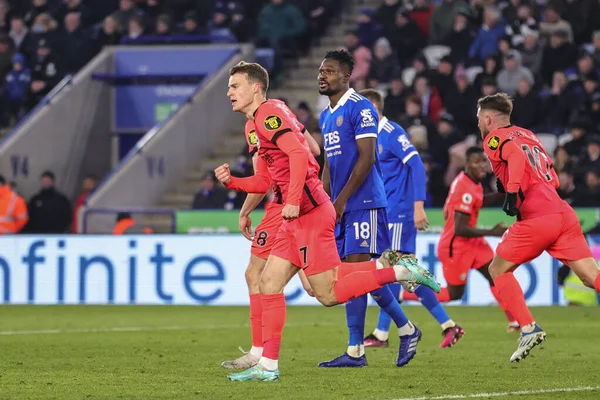 Solly March #7 of Brighton & Hove Albion celebrates Evan Ferguson #28 of Brighton & Hove Albions goal to make it 2-2 during the Premier League match Leicester City vs Brighton and Hove Albion at King Power Stadium, Leicester, United Kingdom