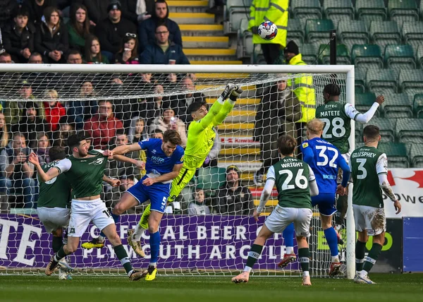 Plymouth Argyle goalkeeper Michael Cooper  (1) punches the ball away  during the Sky Bet League 1 match Plymouth Argyle vs Cheltenham Town at Home Park, Plymouth, United Kingdom, 21st January 202