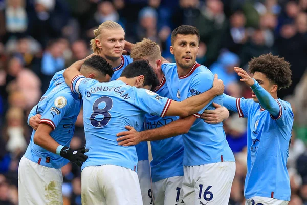 Erling Hland #9 of Manchester City celebrates his goal to make it 1-0 with teammates during the Premier League match Manchester City vs Wolverhampton Wanderers at Etihad Stadium, Manchester, United Kingdom, 22nd January 2023