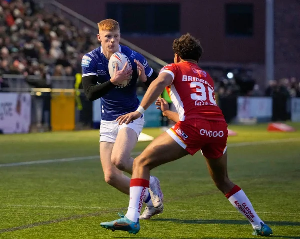 Harvey Barron #26 of Hull FC runs at Mekhi Bridgeman-Reaney #30 of Sheffield Eagles during the Rugby League Pre Season match Sheffield Eagles vs Hull FC at Sheffield Olympic Legacy Park, Sheffield, United Kingdom, 22nd January 202