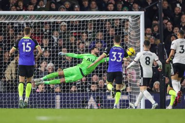 Hugo Lloris #1 of Tottenham Hotspur saves from Manor Solomon #11 of Fulham during the Premier League match Fulham vs Tottenham Hotspur at Craven Cottage, London, United Kingdom, 23rd January 202