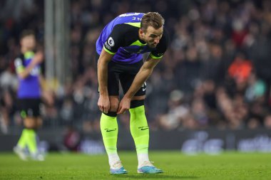 Harry Kane #10 of Tottenham Hotspur adjusts his sock during the Premier League match Fulham vs Tottenham Hotspur at Craven Cottage, London, United Kingdom, 23rd January 202