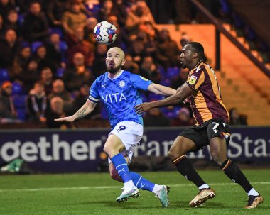 Paddy Madden #9 of Stockport County challenged by Tolaji Bola #7 of Bradford City during the Sky Bet League 2 match Stockport County vs Bradford City at Edgeley Park Stadium, Stockport, United Kingdom, 24th January 202