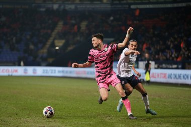 Corey O'Keeffe #2 of Forest Green Rovers in possession whilst being under pressure by Randell Williams #27 of Bolton Wanderers during the Sky Bet League 1 match Bolton Wanderers vs Forest Green Rovers at University of Bolton Stadium, Bolton, United K