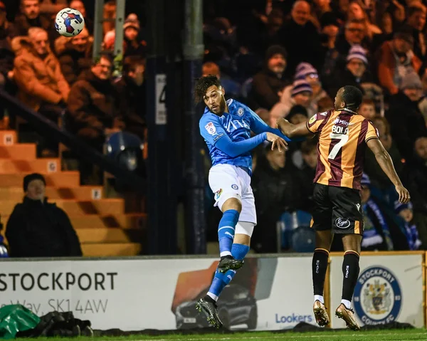 Kyle Wootton #19 of Stockport County and Tolaji Bola #7 of Bradford City challenge for a header during the Sky Bet League 2 match Stockport County vs Bradford City at Edgeley Park Stadium, Stockport, United Kingdom, 24th January 202