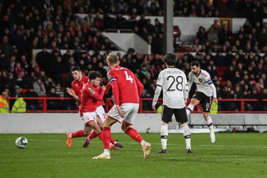 Bruno Fernandes #8 of Manchester United scores to make it 0-3 during the Carabao Cup Semi-Finals match Nottingham Forest vs Manchester United at City Ground, Nottingham, United Kingdom, 25th January 202