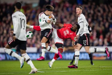 Serge Aurier #24 of Nottingham Forest and Lisandro Martnez #6 of Manchester United battle for the ball during the Carabao Cup Semi-Finals match Nottingham Forest vs Manchester United at City Ground, Nottingham, United Kingdom, 25th January 2023