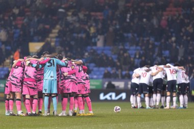 Both teams huddle before the Sky Bet League 1 match Bolton Wanderers vs Forest Green Rovers at University of Bolton Stadium, Bolton, United Kingdom, 24th January 202