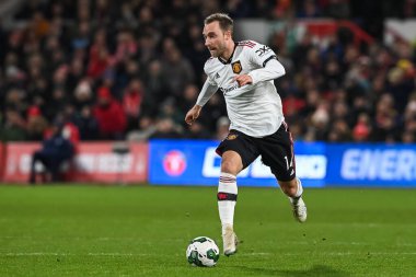 Christian Eriksen #14 of Manchester United makes a break with the ball during the Carabao Cup Semi-Finals match Nottingham Forest vs Manchester United at City Ground, Nottingham, United Kingdom, 25th January 202