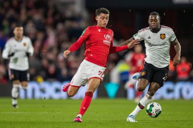 Brennan Johnson #20 of Nottingham Forest and Aaron Wan-Bissaka #29 of Manchester United rum for the ball during the Carabao Cup Semi-Finals match Nottingham Forest vs Manchester United at City Ground, Nottingham, United Kingdom, 25th January 202