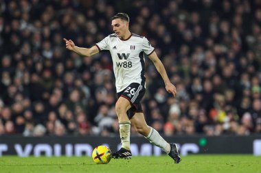 Joo Palhinha #26 of Fulham makes a break with the ball during the Premier League match Fulham vs Tottenham Hotspur at Craven Cottage, London, United Kingdom, 23rd January 2023 clipart