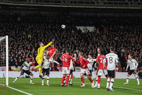 scores a penalty to make it punches clear as Sam Surridge #16 of Nottingham Forest challenges during the Carabao Cup Semi-Finals match Nottingham Forest vs Manchester United at City Ground, Nottingham, United Kingdom, 25th January 2023