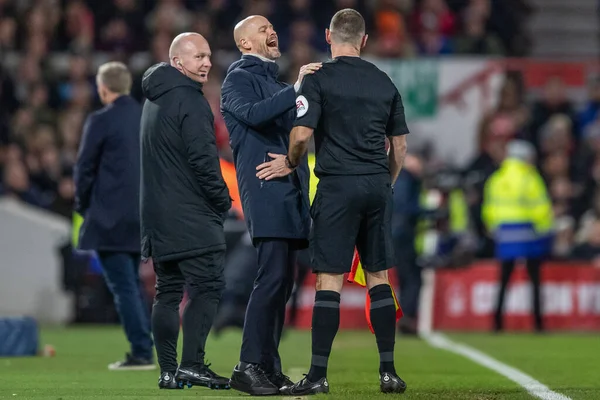 stock image Erik ten Hag manager of Manchester United laughs with the linesman after Marcus Rashford #10 of Manchester United scores a goal to make it 0-1 during the Carabao Cup Semi-Finals match Nottingham Forest vs Manchester United at City Ground, Nottingham,