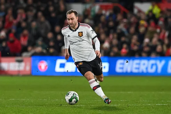 Christian Eriksen #14 of Manchester United makes a break with the ball during the Carabao Cup Semi-Finals match Nottingham Forest vs Manchester United at City Ground, Nottingham, United Kingdom, 25th January 202
