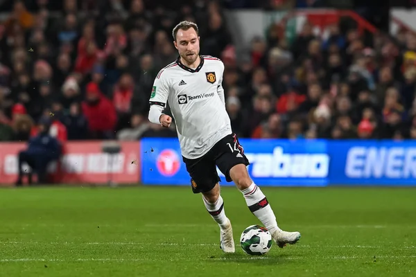 Christian Eriksen #14 of Manchester United makes a break with the ball during the Carabao Cup Semi-Finals match Nottingham Forest vs Manchester United at City Ground, Nottingham, United Kingdom, 25th January 202