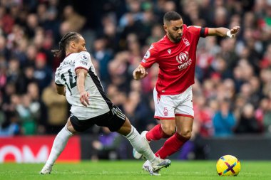 Renan Lodi #32 of Nottingham Forest takes on Bobby Reid #14 of Fulham during the Premier League match Fulham vs Nottingham Forest at Craven Cottage, London, United Kingdom, 11th February 202