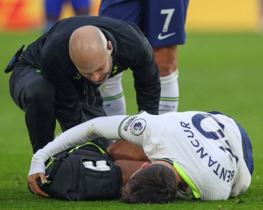 Rodrigo Bentancur #30 of Tottenham Hotspur receives medical treatment during the Premier League match Leicester City vs Tottenham Hotspur at King Power Stadium, Leicester, United Kingdom, 11th February 202