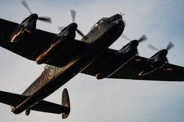 The Battle of Britain Memorial Flight Lancaster returns to RAF Coningsby after the flypast for Trooping the colour in London clipart