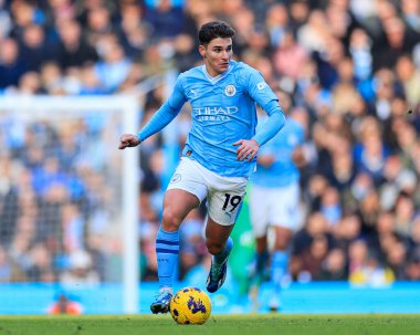 Julian Alvarez #19 of Manchester City controls the ball during the Premier League match Manchester City vs Liverpool at Etihad Stadium, Manchester, United Kingdom, 25th November 2023 clipart