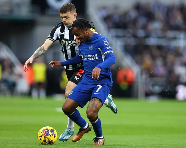 stock image Kieran Trippier #2 of Newcastle United challenges Raheem Sterling #7 of Chelsea for possession during the Premier League match Newcastle United vs Chelsea at St. James's Park, Newcastle, United Kingdom, 25th November 2023