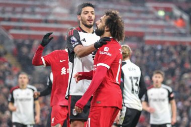 Ral Jimnez #7 of Fulham consoles Mohamed Salah #11 of Liverpool after a missed chance on goal during the Premier League match Liverpool vs Fulham at Anfield, Liverpool, United Kingdom, 3rd December 2023 clipart