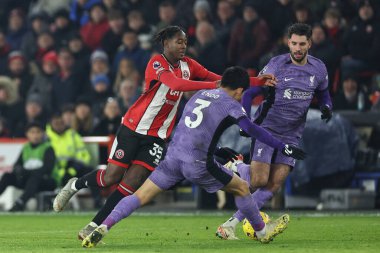 Sheffield United 'dan Andre Brooks 6 Aralık 2023' te Bramall Lane, Sheffield, İngiltere 'de oynanan Premier League maçında Liverpool' lu Wataru Endo # 3 ile karşılaştı.
