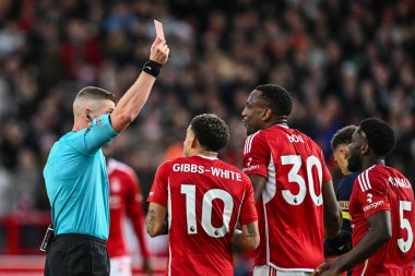 Referee Robert Jones gives a red card to Willy Boly of Nottingham Forest during the Premier League match Nottingham Forest vs Bournemouth at City Ground, Nottingham, United Kingdom, 23rd December 202 clipart