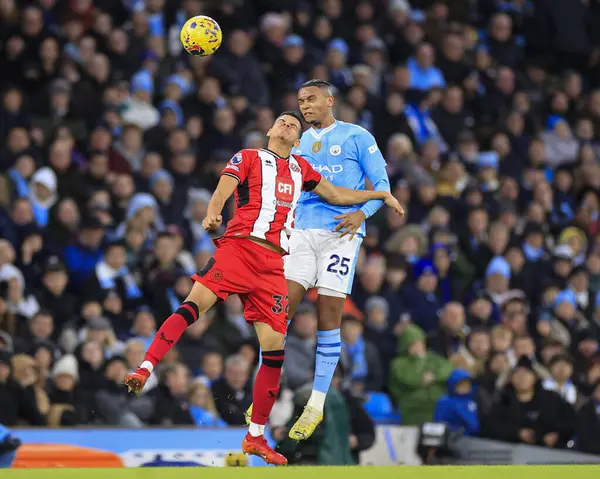 stock image Manuel Akanji #25 of Manchester City wins the header against William Osula #32 of Sheffield United during the Premier League match Manchester City vs Sheffield United at Etihad Stadium, Manchester, United Kingdom, 30th December 202