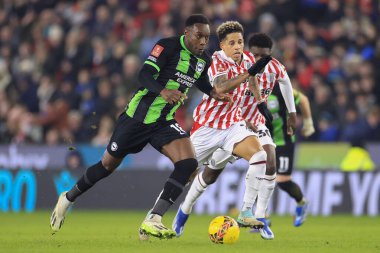 Brighton & Hove Albion 'dan Danny Welbeck, 6 Ocak 202' de İngiltere 'nin Stoke-on-Trent Stadyumu' nda Stoke City ile Brighton ve Hove Albion maçında Stoke City 'den Andre Vidigal' i geçiyor.