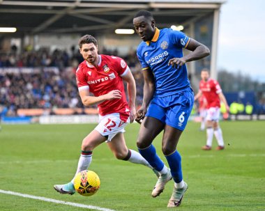 Shrewsbury Town 'dan Jason Sraha ve Wrexham' dan George Evans, 7 Ocak 202 'de Croud Meadow, Shrewsbury, İngiltere' de oynanan Emirates FA Cup üçüncü tur karşılaşmasında top için savaştılar.