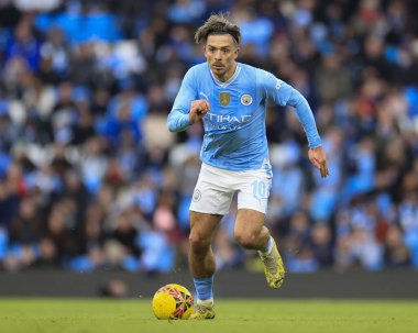 Manchester City 'den Jack Grealish, 7 Ocak 202 tarihinde Etihad Stadyumu' nda Manchester City ile Huddersfield Town arasındaki FA Cup üçüncü tur karşılaşmasında topla koşuyor.