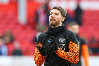 Blackpool 'dan James Husband, Birleşik Krallık' ın Nottingham şehrinde oynanan ve 7 Ocak 202 tarihinde oynanan, Emirates FA Cup 3. tur karşılaşması öncesinde oynanan maçta Nottingham Forest 'a karşı Blackpool maçında ısındı.