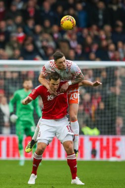 Blackpool 'dan Oliver Casey, Nottingham Ormanı' ndan Chris Wood 'un, Birleşik Krallık' ın Nottingham, İngiltere 'nin başkenti Nottingham' da oynanan üçüncü tur müsabakasında Nottingham Forest 'a karşı oynadığı üçüncü tur karşılaşmasında başını öne eğdi.