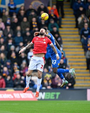 Steven Fletcher of Wrexham battles for a header with Cheyenne Dunkley of Shrewsbury Town, during the Emirates FA Cup Third Round match Shrewsbury Town vs Wrexham at Croud Meadow, Shrewsbury, United Kingdom, 7th January 202