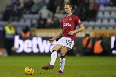 Manchester United takımından Jonny Evans, 8 Ocak 202 'de Wigan Atletizm ve Manchester United' a karşı oynanan üçüncü tur karşılaşmasında, Birleşik Krallık 'ın başkenti Wigan' da mücadele etti.