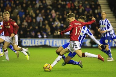 Alejandro Garnacho of Manchester United shoots on goal during the Emirates FA Cup Third Round match Wigan Athletic vs Manchester United at DW Stadium, Wigan, United Kingdom, 8th January 2024 clipart