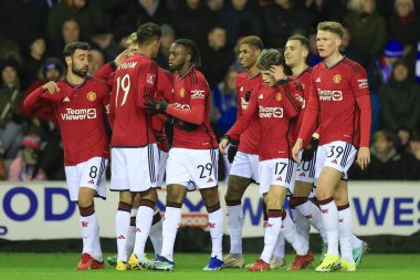 Manchester United players celebrate a goal by Diogo Dalot to make it 0-1 during the Emirates FA Cup Third Round match Wigan Athletic vs Manchester United at DW Stadium, Wigan, United Kingdom, 8th January 2024 clipart