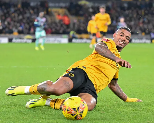 stock image Mario Lemina of Wolverhampton Wanderers attempts to keep the ball in play, during the Emirates FA Cup Third Round Replay match Wolverhampton Wanderers vs Brentford at Molineux, Wolverhampton, United Kingdom, 16th January 2024 