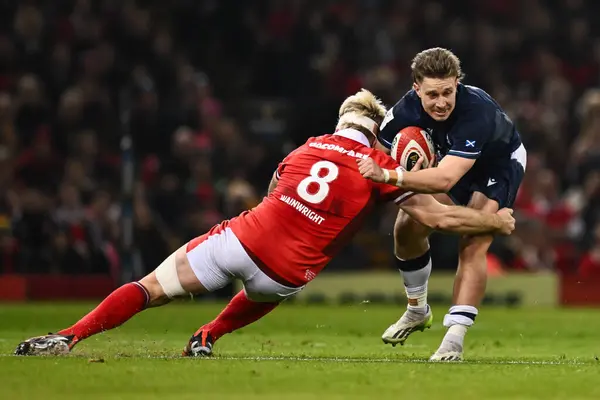 stock image Kyle Rowe of Scotland is tackled by Aaron Wainwright of Wales during the 2024 Guinness 6 Nations match Wales vs Scotland at Principality Stadium, Cardiff, United Kingdom, 3rd February 202